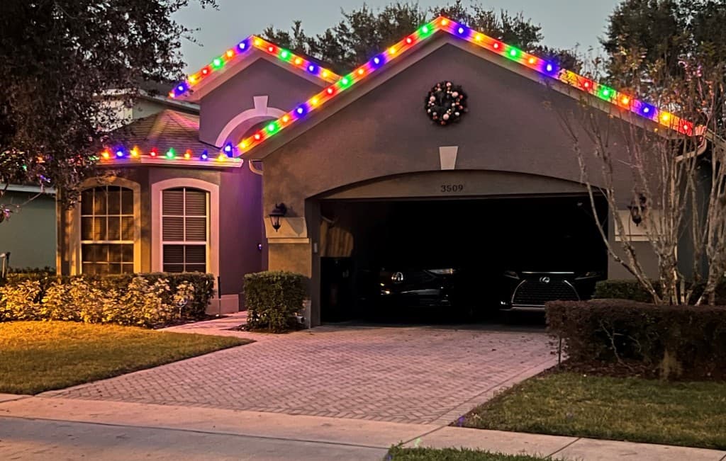 Single story install with a multicolor roofline outline over the garage and entry